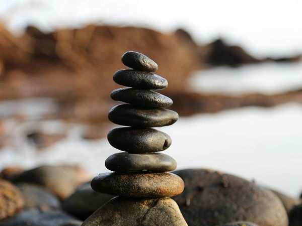 Minimalist composition with stones and water representing balance
