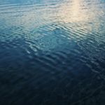 Smooth arctic water ripples during sunset